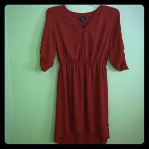 A Beautiful, Rust colored dress, in size “Medium”
